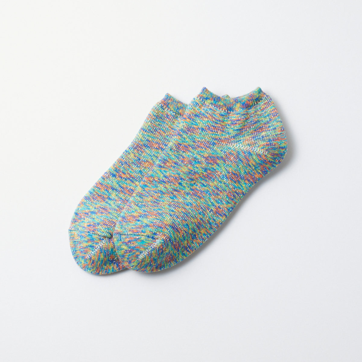 Washi pile short socks with a colorful speckled knit pattern, laid flat.