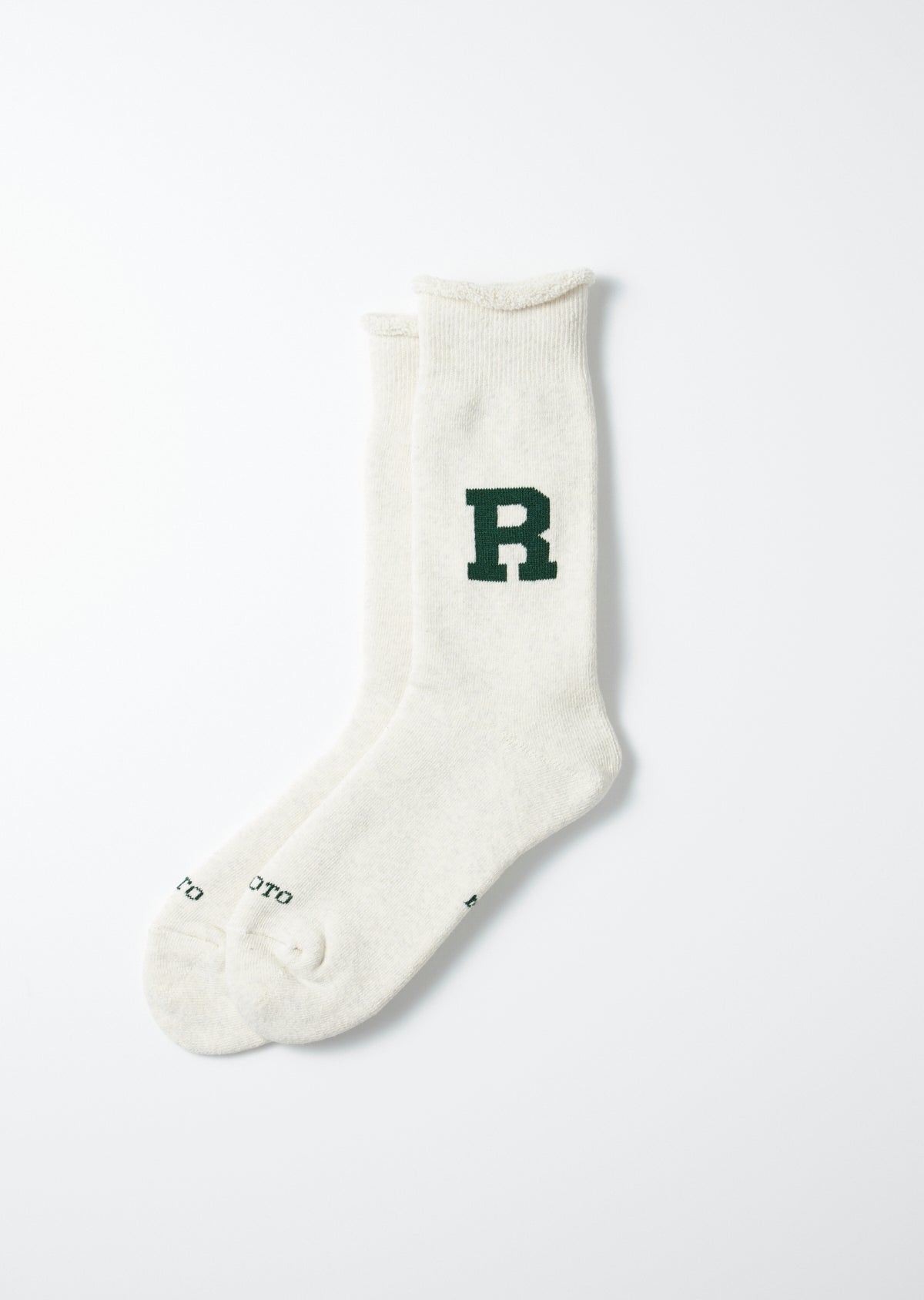 Off-white knit socks by Raffy with a dark green 'R' logo and 'ROTO' text on the heel.
