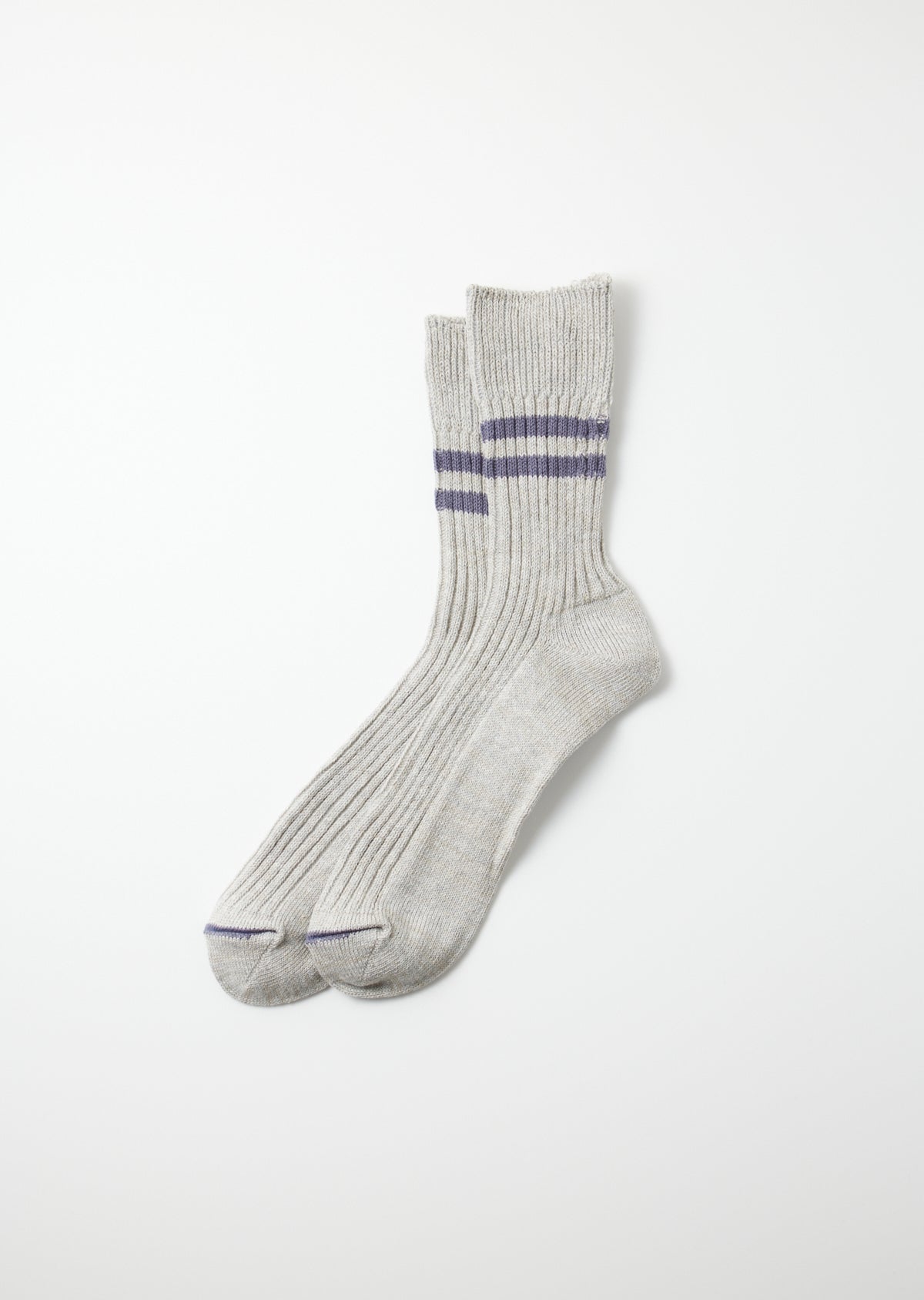 Pair of light gray hemp organic cotton socks with purple stripes on the ribbed cuffs and reinforced toes.