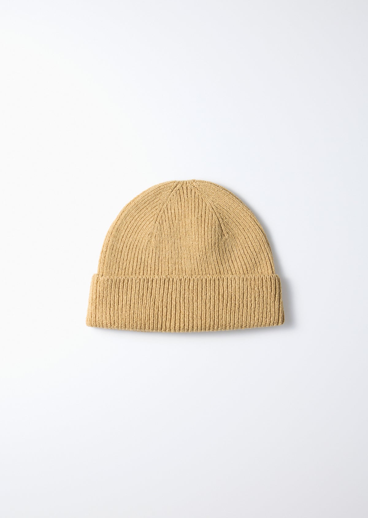 Beige washi/recycled cotton beanie with ribbed knit texture and folded cuff on a white background.