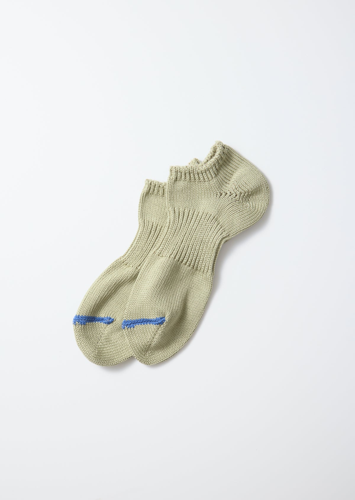 A pair of light khaki chunky sneaker socks with blue stripes on the toes, knitted and laid flat.