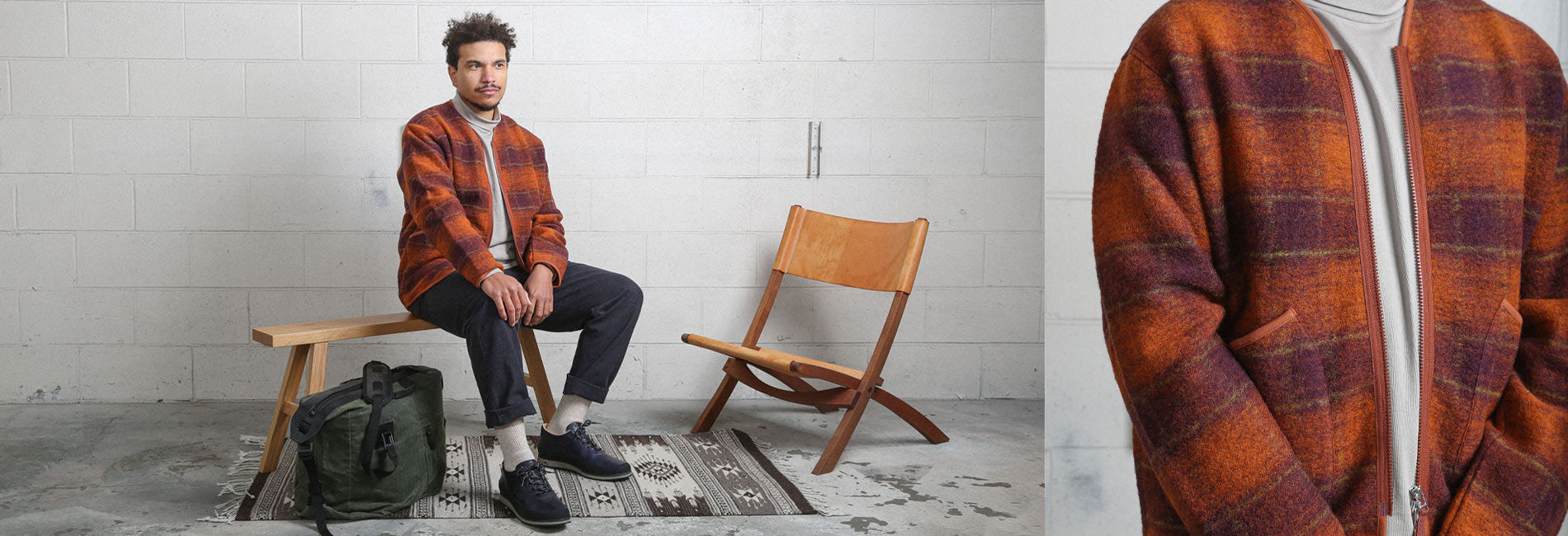Rich orange and burgundy plaid jacket, cozy turtleneck, dark pants, and rugged shoes — stylish, warm, urban fall essentials.