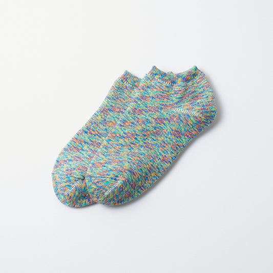 Washi pile short socks with a colorful speckled knit pattern, laid flat.
