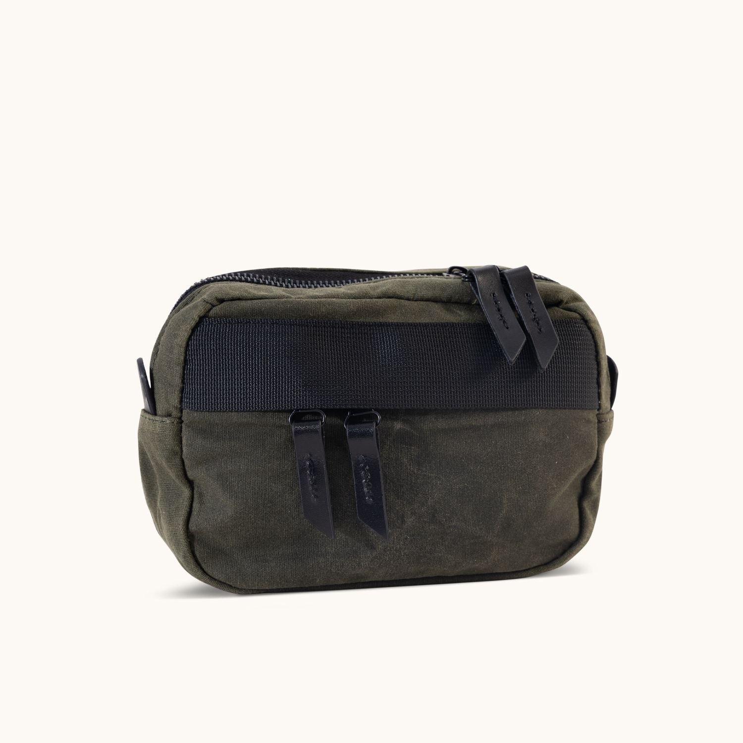 Juniper Green Waxed Canvas Canyon Crossbody Mini with black zipper and pulls on a white background.