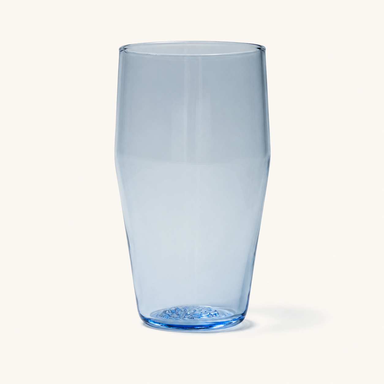 Clear standard pint glass with subtle blue tint and embossed base, front view on white background