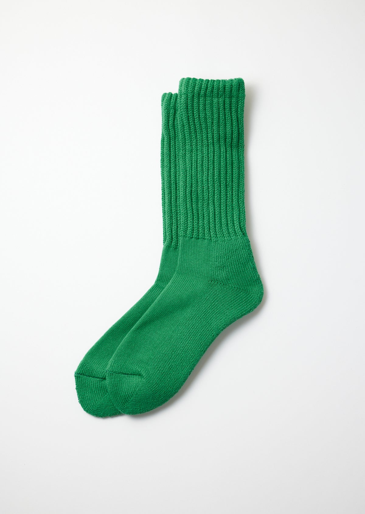 Green Loose Pile Crew Socks with a prominent ribbed texture on the leg, lying flat.