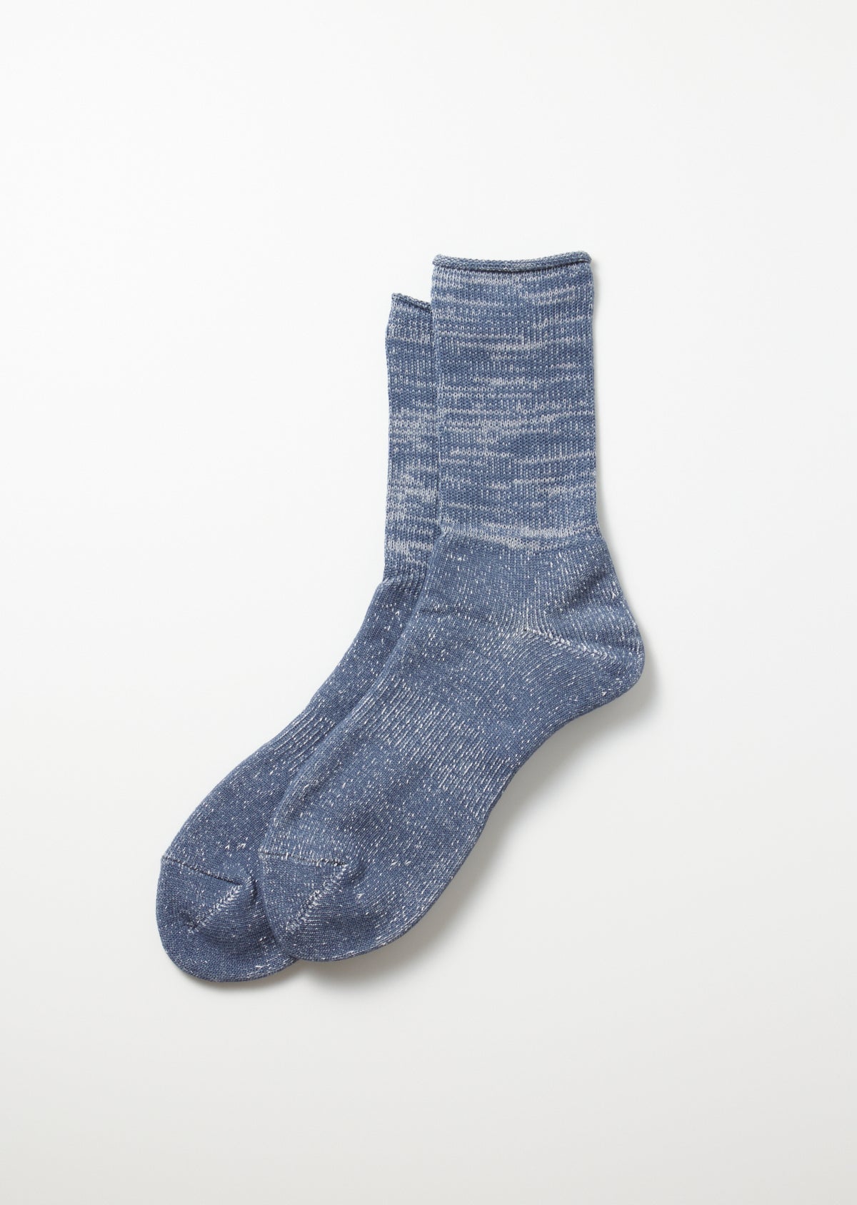 Pair of slate blue Washi Pile crew socks with a heathered, speckled texture and ribbed cuff, lying flat.