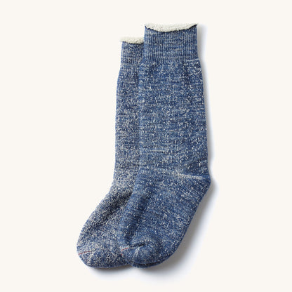 Deep Ocean Double Face Crew Socks with a heathered blue texture, ribbed cuffs, and soft white fringed tops.