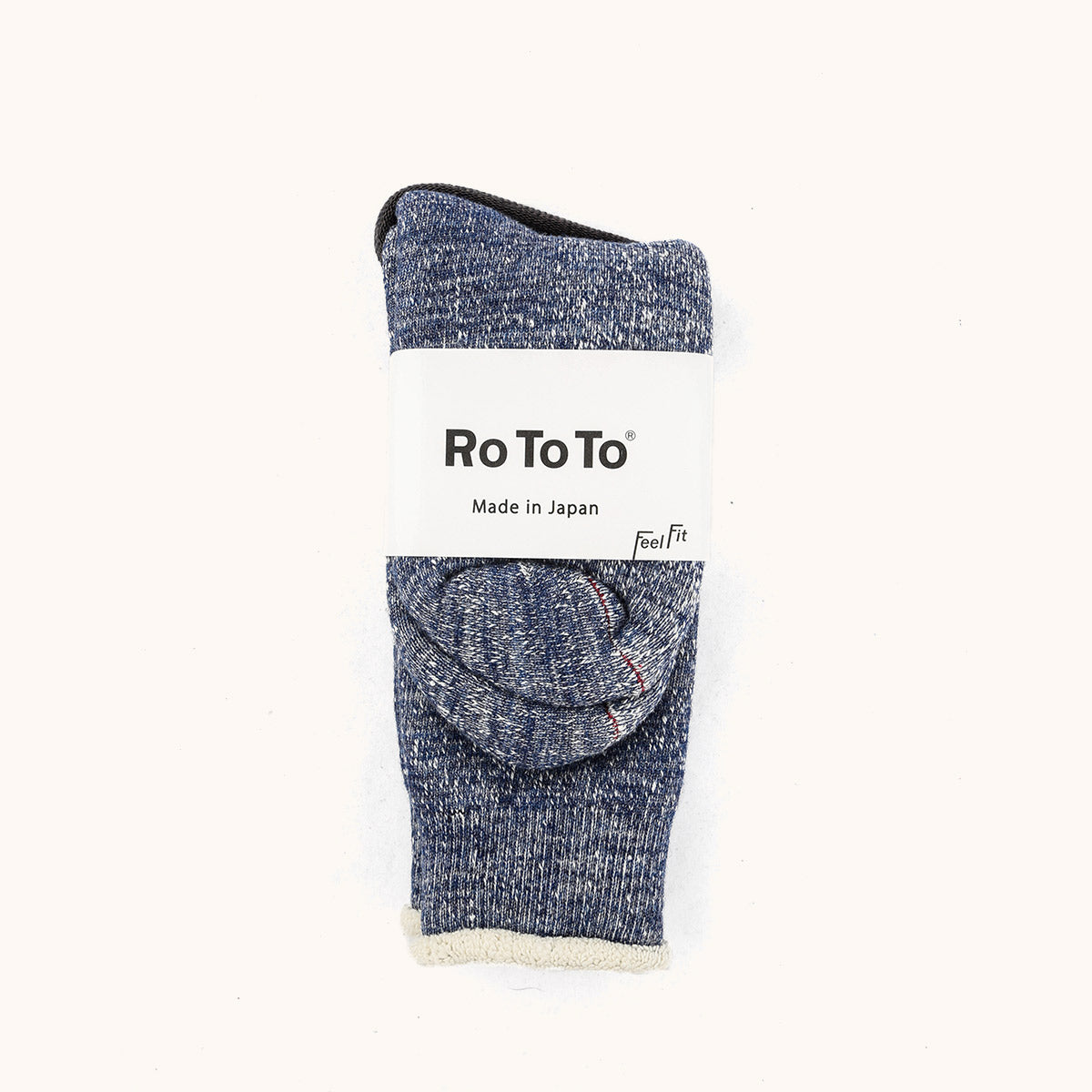 Deep Ocean Double Face Crew Socks by Ro To To, folded with a mottled blue-grey texture and creamy white interior cuff.
