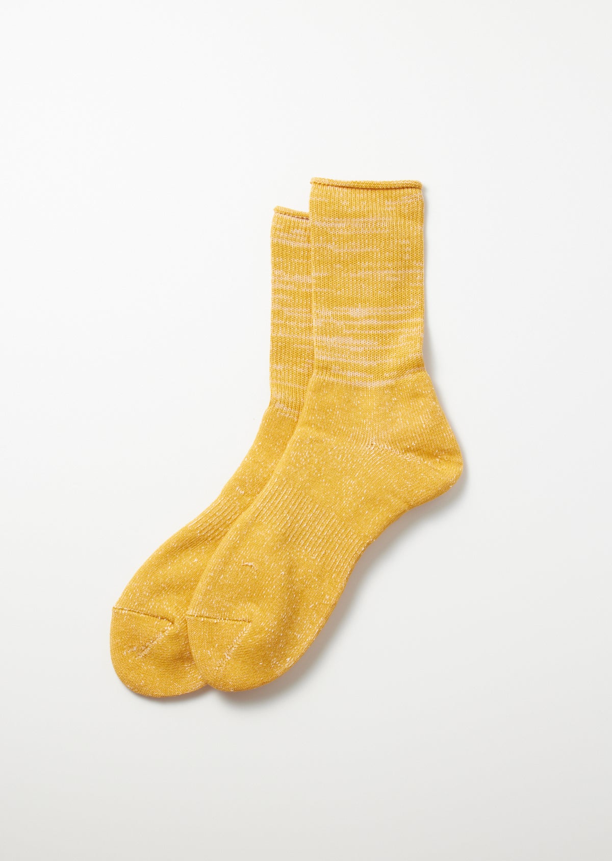 Yellow Washi Pile crew socks with a heathered knit texture and light speckles, laid flat.