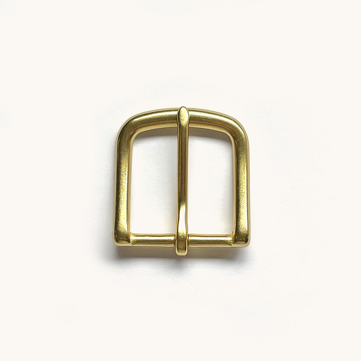 Classic belt with a polished brass buckle.