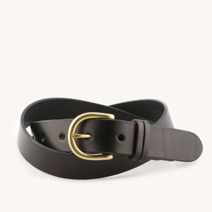 Black leather belt with a brass-toned D-ring buckle, coiled on a white background.
