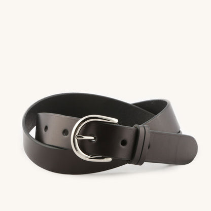 Black leather belt featuring a shiny silver-tone D-ring buckle and keeper loop, coiled.
