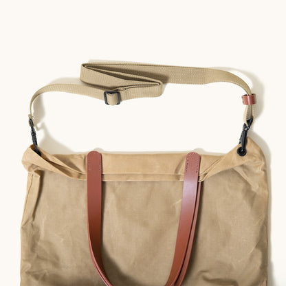 Utility tan waxed canvas Simple Tote with brown leather handles and a detachable tan shoulder strap.