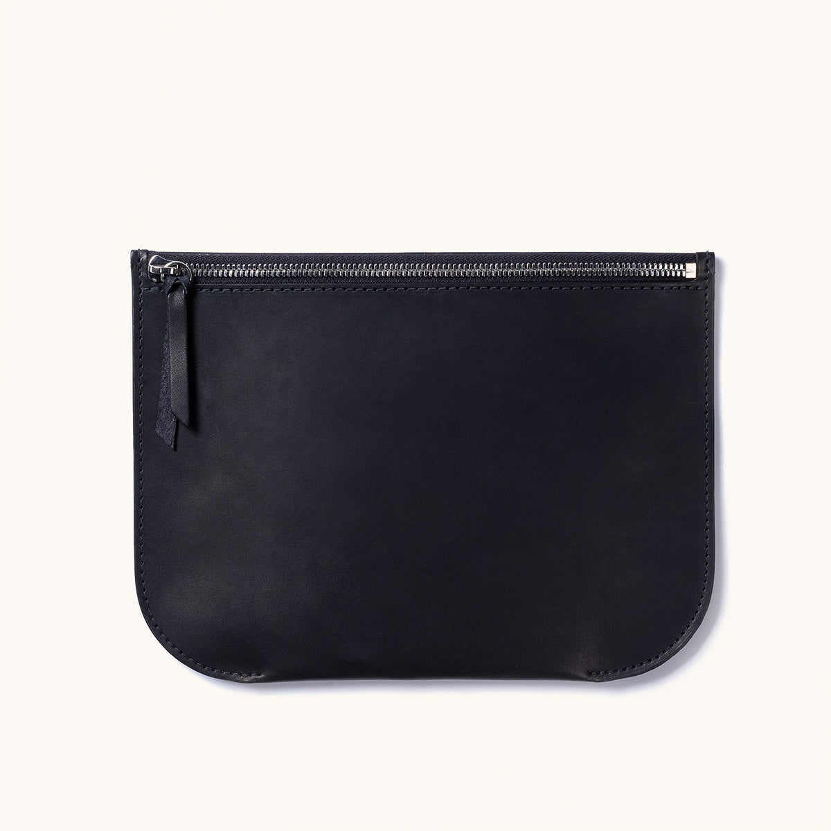 Black leather Universal Zip Pouch with a silver zipper, leather pull, and rounded bottom corners.
