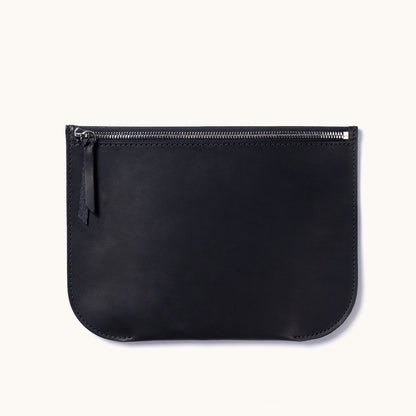 Black leather Universal Zip Pouch with a silver zipper, leather pull, and rounded bottom corners.