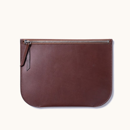 Brown leather Universal Zip Pouch with a silver zipper and a leather pull tab, displayed flat.