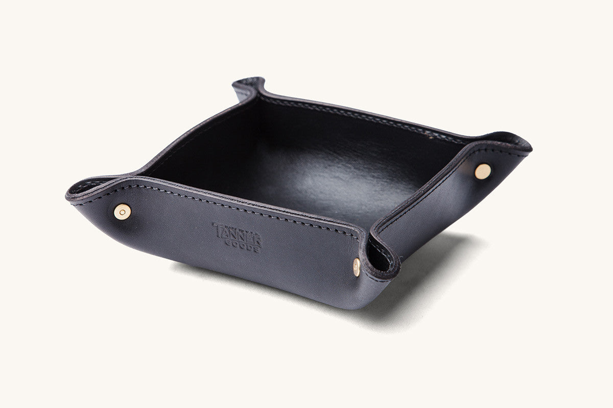 Black leather valet tray by TANNER GOODS, with gold-tone snaps.
