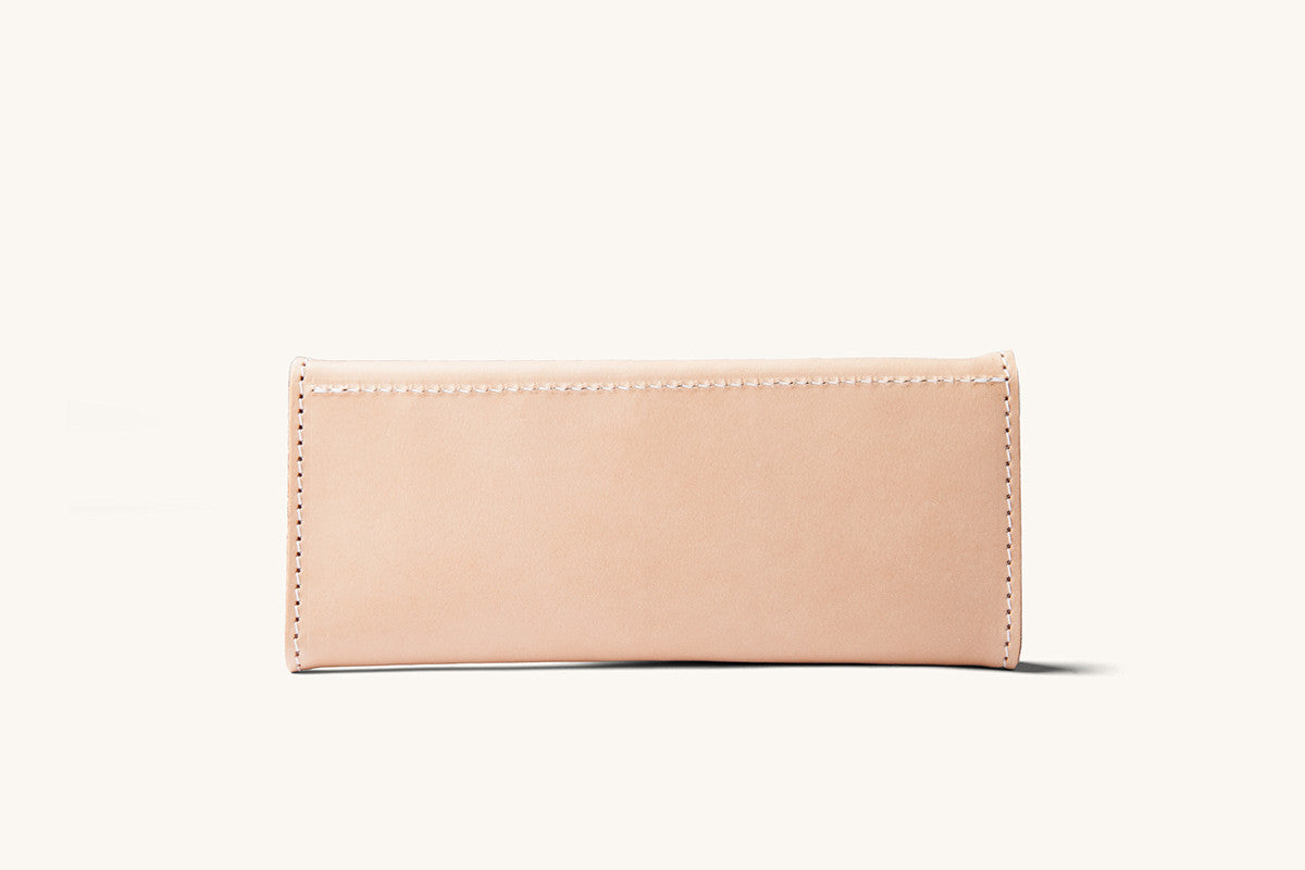 Natural leather Workman wallet with visible white stitching, presented cleanly.